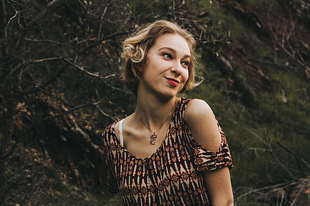 woman wearing beige and black cold-shoulder shirt thumbnail