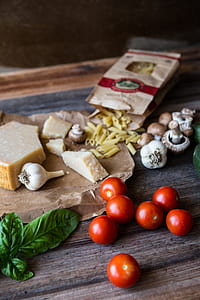 tomato, mushroom. and garlic on wooden table thumbnail