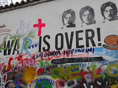 The Beatles and war is over text mural on white wall thumbnail