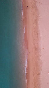 areal photo of seashore and body of water thumbnail