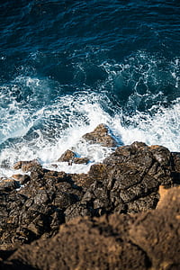 aerial photo of rock and sea thumbnail