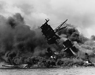 grayscale photography of destroyed ship with smoke thumbnail