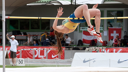 woman high jumping at daytime thumbnail