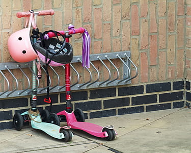 Kids roller scooters parked. thumbnail