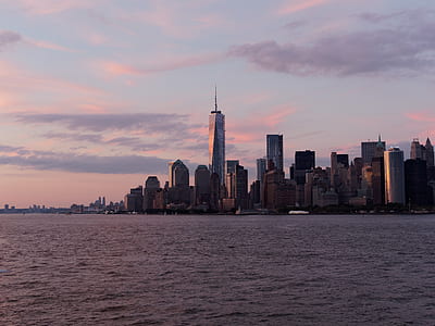 gray buildings near body of water thumbnail