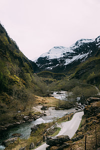 aerial photography of river between mountain at daytime thumbnail