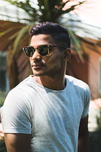 man wearing white crew-neck shirt and sunglasses thumbnail