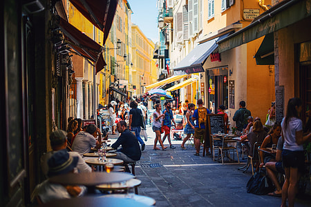 group of people walking on town during daytime thumbnail