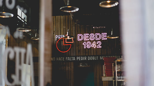 person showing Desde 1942 signage thumbnail