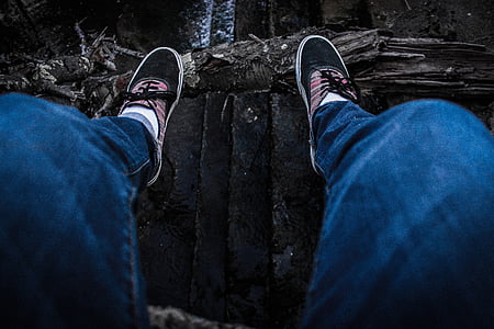 person wearing blue stonewashed denim fitted jeans thumbnail