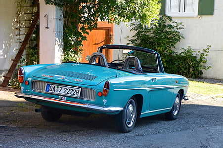 blue convertible parked outside the house thumbnail
