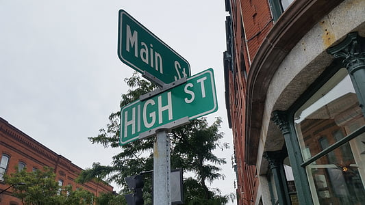 Main st. and High st. street sign under gray sky at daytime thumbnail