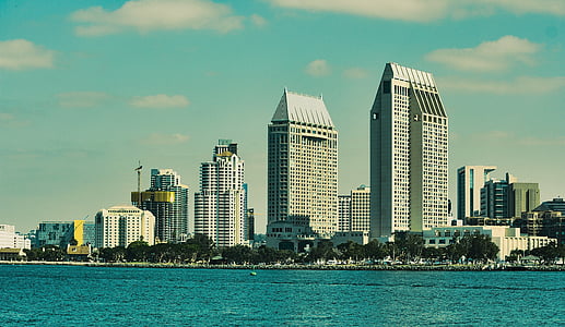 white high-rise buildings beside body of water at daytime thumbnail