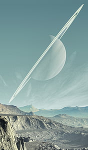 ringed planet over brown mountains during daytime thumbnail