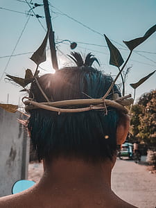 person wearing brown crown thumbnail