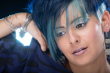 person in blue top with blue hair thumbnail