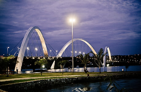 three white arch near street light at daytime thumbnail