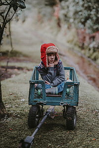 boy sitting on wagon thumbnail