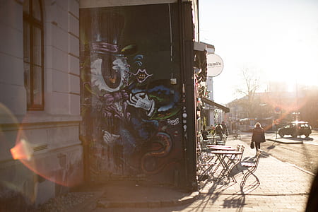 person showing graffiti wall art thumbnail