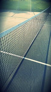 selective focus photography of white tennis net thumbnail