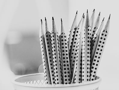 grayscale photography of pencils inside tray thumbnail