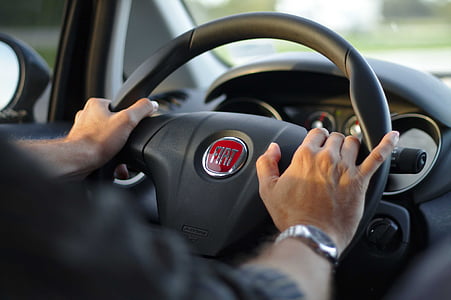 person sitting inside car thumbnail