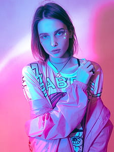 woman in white shirt with pink light thumbnail