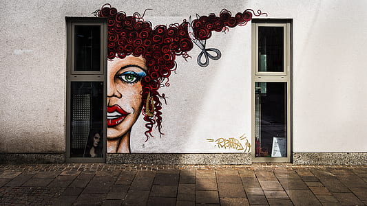 woman with brown curl hair mural between of windows thumbnail