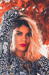 closeup photo of woman wearing black and white floral tops thumbnail