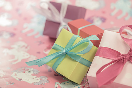 selective focus photography of four present boxes thumbnail