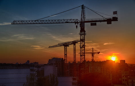 silhouette of crane during sunset thumbnail