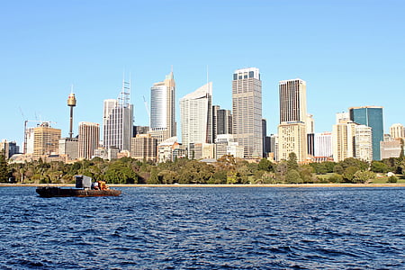 brown boat near Sydney buildings during daytime thumbnail