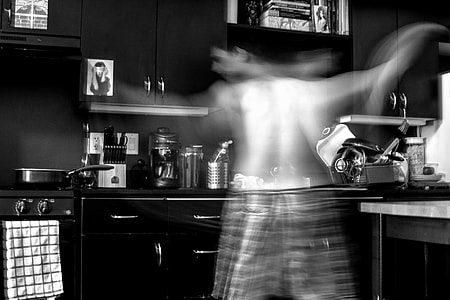 man standing near gas range thumbnail