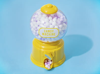 yellow candy machine dispenser on blue able thumbnail