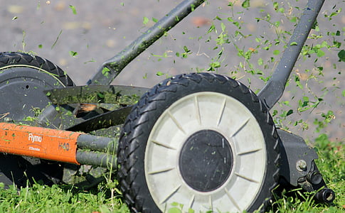 gray and orange reel mower on focus photo thumbnail