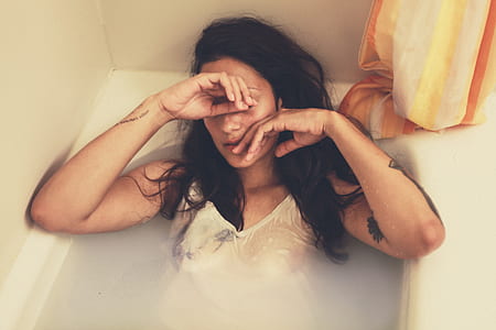 woman in white top on bathtub thumbnail