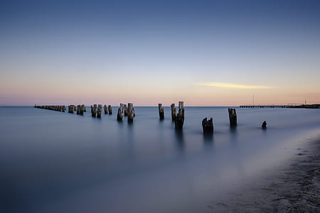 gray post on seashore thumbnail