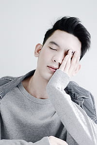 man sleeping with his hand on his face thumbnail