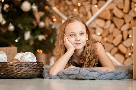 girl lying on gray knit pad thumbnail