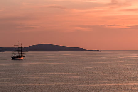 sailboat sailing on calm water thumbnail