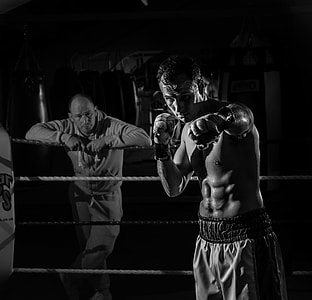grayscale photography of boxer inside ring thumbnail