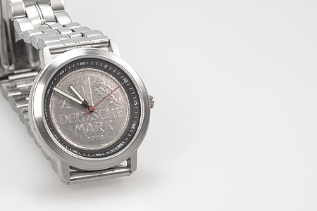 round 1978 silver-colored Deutsche Mark analog watch displaying 11:52 time thumbnail