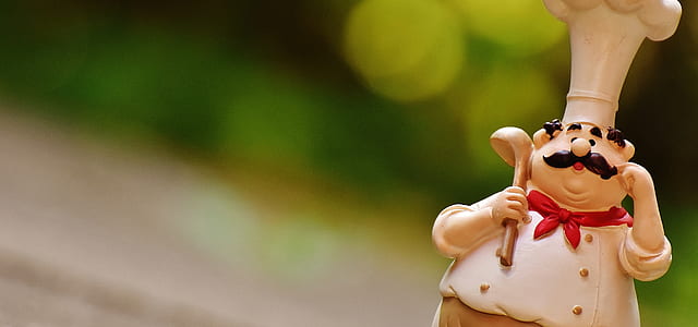 selective focus photography of chef figurine thumbnail