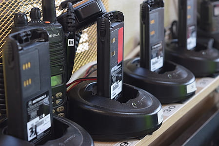 selective focus photo of black Motorola 2-way radio chargers thumbnail