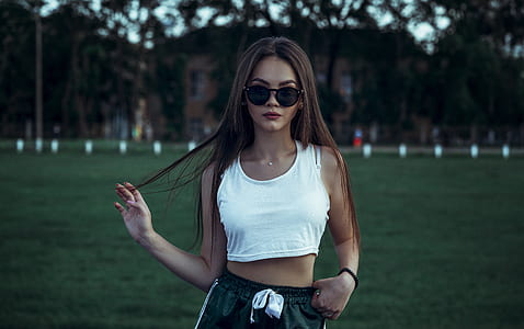 woman in white crop top posing for photo thumbnail