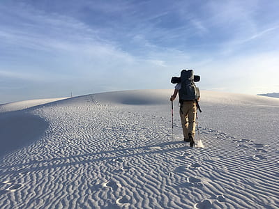 man hiking on mountain covered with snow thumbnail