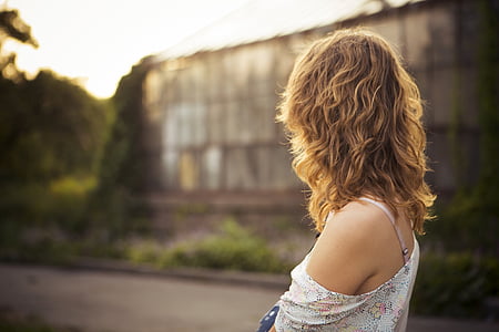 shallow focus photography of woman in white off-shoulder top thumbnail