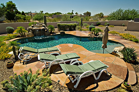 photo of swimming pool with sun loungers thumbnail
