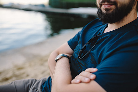 Young Man Using His Phone on beach thumbnail