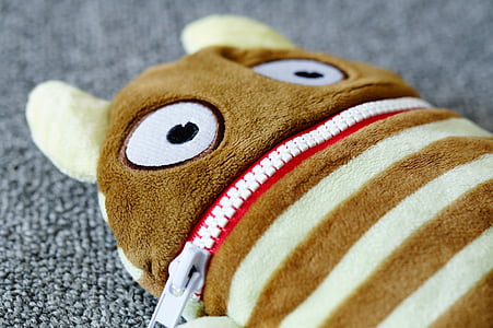 brown and beige striped animal wallet on gray textile thumbnail